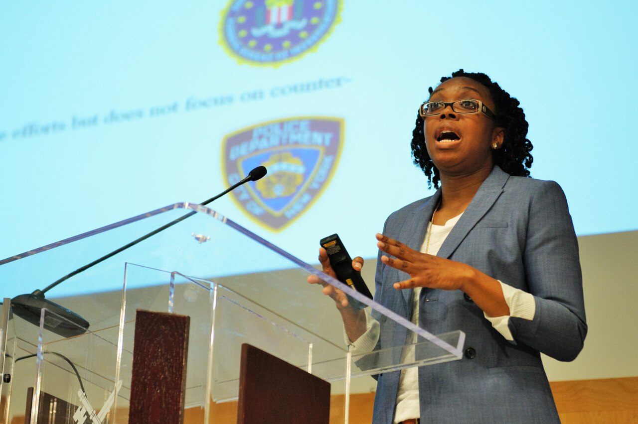 Kemisha D. Sherrell, a fellow at the National Defense University’s College of International Security Affairs, presents her thesis on assessing U.S. strategies to counter violent radicalization during the college’s thesis symposium, May 24, 2016. Courtesy photo
