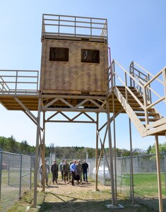 Maj. Gen. Patrick Reinert, Fort McCoy senior commander and 88th Regional Support Command commanding general and Col. David Pinter, Fort McCoy garrison commander, along with members of the Ft. McCoy command staff, MWR personnel and Army Reserve Ambassador William Bissonette, conduct a ground tour of the extensive training capabilities provided by the Range Complex on Fort McCoy, Wis., May 23.