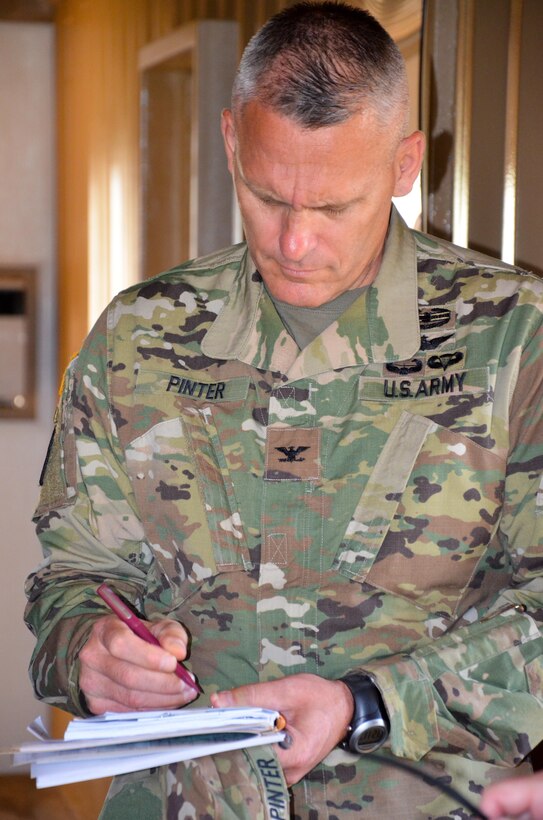 Col. David Pinter, Fort McCoy garrison commander takes notes during a ground tour of the extensive training capabilities provided by the Range Complex on Fort McCoy, Wis., May 23.

As a Total Force Training Center, Ft. McCoy's primary responsibility is to support the training and readiness of military personnel and units of all branches and components of America's armed forces.