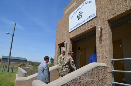 Maj. Gen. Patrick Reinert, Fort McCoy senior commander and 88th Regional Support Command commanding general (right) and Col. David Pinter, Fort McCoy garrison commander (left), along with members of the Ft. McCoy command staff, MWR personnel and Army Reserve Ambassador William Bissonette, conduct a ground tour of the extensive training facilities provided by Fort McCoy’s Range Complex, May 23.