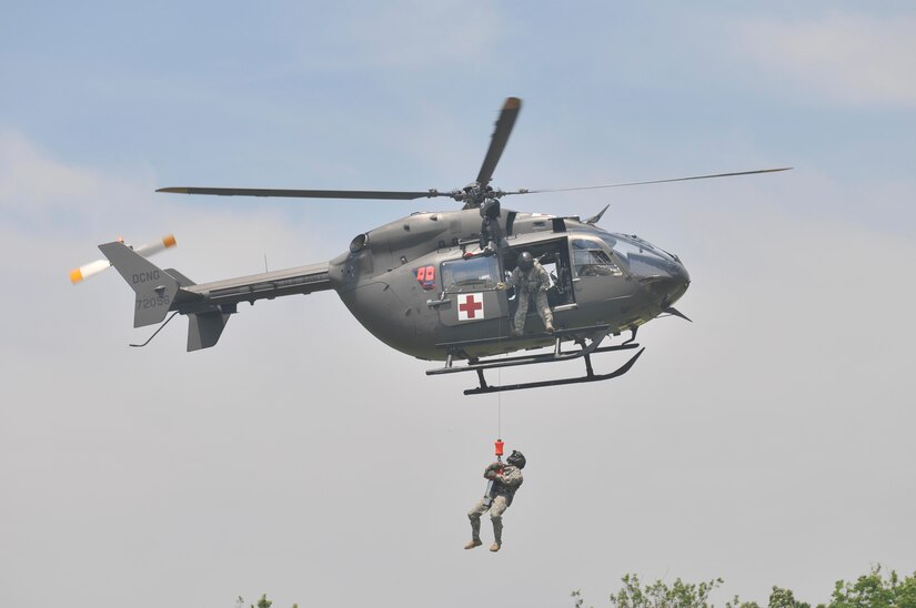 A joint aviation exercise between Army Reserve, active duty and National Guard soldiers in the District of Columbia at Fort Belvoir’s Davison Army Airfield Wednesday, May 25th 2016. This was the first multi-day, multi-component contingency mission exercise held in recent history. Refueling, sling load and hoist operations as well as a mixed multi-ship formation flight over D.C. involving Army Reserve CH-47 “Chinooks”, active duty UH-60 “Black Hawks,” National Guard LUH-72 “Lakotas”, and an Air Force UH-1 “Huey” showcase the Total Army’s ability to support the National Defense Strategy and Army commitments at home and around the world. (Photo by Capt. Xeriqua Garfinkel, U.S. Army Reserve/Released)