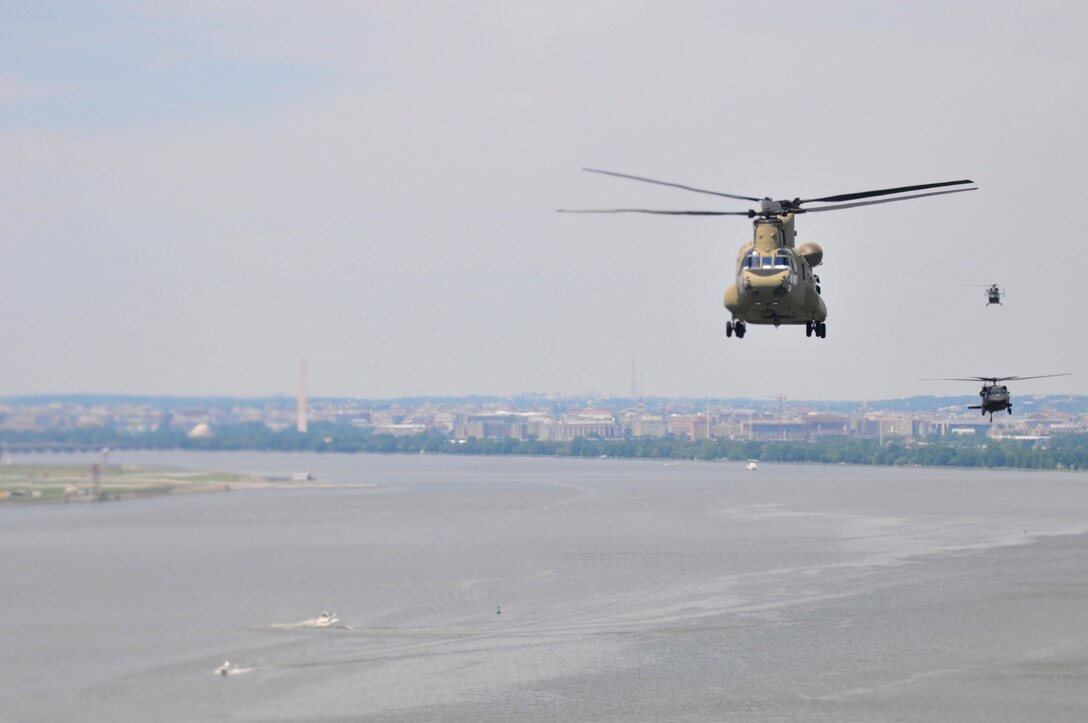 A joint aviation exercise between Army Reserve, active duty and National Guard soldiers in the District of Columbia at Fort Belvoir’s Davison Army Airfield Wednesday, May 25th 2016. This was the first multi-day, multi-component contingency mission exercise held in recent history. Refueling, sling load and hoist operations as well as a mixed multi-ship formation flight over D.C. involving Army Reserve CH-47 “Chinooks”, active duty UH-60 “Black Hawks,” National Guard LUH-72 “Lakotas”, and an Air Force UH-1 “Huey” showcase the Total Army’s ability to support the National Defense Strategy and Army commitments at home and around the world. (Photo by Capt. Xeriqua Garfinkel, U.S. Army Reserve/Released)