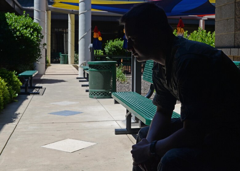 An Airman simulates contemplating about the stressors of military life and how it can affect his career May 25, 2016, at Beale Air Force Base, California. The Military Family Life Consultant (MFLC) are master or Ph.D. level professionals who are experienced social workers, psychologists and marriage and family therapists. They provide free brief counseling services to active duty airmen and their loved ones, which is confidential. However, if there is any safety concerns of harm to self or others, the MFLC is required to transition the individual to Mental Health, Family Advocacy or Chapel Corps. (U.S. Air Force photo by Senior Airman Ramon A. Adelan)
