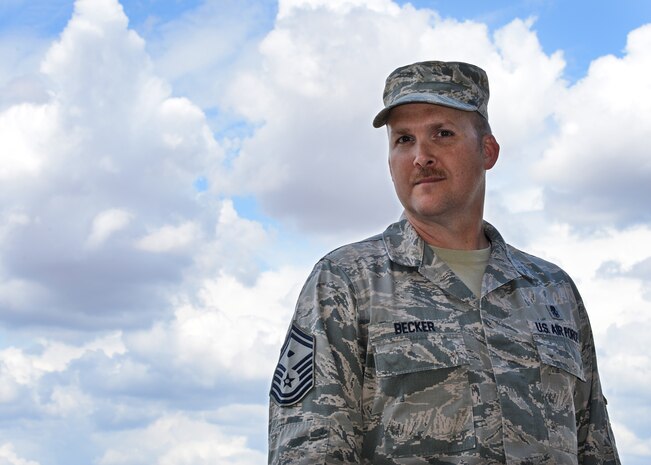 SMSgt Bradley Becker, 9th AMXS, First Sergeant, poses for a photo at Beale Air Force Base, California. (U.S. Air Force photo by Robert Scott) 