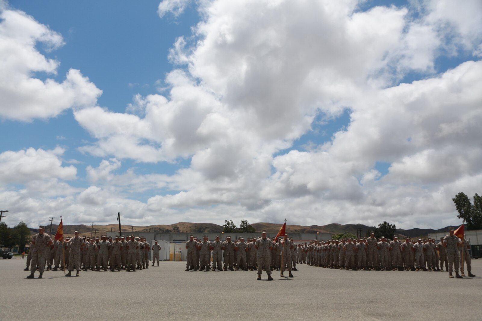 U.S. Marines with 1st Maintenance Battalion, Combat Logistics Regiment 15, 1st Marine Logistics Group await the arrival of Gen. Robert Neller Commandant of the Marine Corps, on Camp Pendleton, Calif., May 24, 2016. Gen. Neller addressed the future of the Marine Corps and answered questions from the Marines. (U.S. Marine Corps photo by Sgt. Rodion Zabolotniy, Combat Camera, Camp Pendleton/RELEASED)