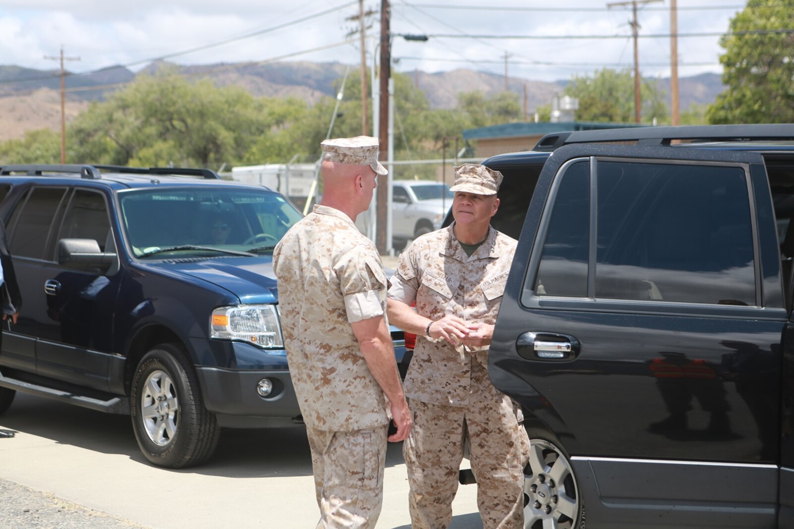 U.S. Marine Corps Gen. Robert Neller, Commandant of the Marine Corps, meets with Brig. Gen. David Ottignon, commanding general, 1st Marine Logistics Group to talk about the current and future 3D printing operations using the Expeditionary Manufacturing System within the 1st MLG on Camp Pendleton, Calif., May 24, 2016. The Expeditionary Manufacturing System is a mobile 3D printing and milling shop designed to provide quick turnaround for mission critical parts in deployed environment. (U.S. Marine Corps photo by Sgt. Rodion Zabolotniy, Combat Camera, Camp Pendleton/RELEASED)