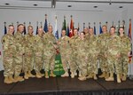 Army Maj. Gen. Richard Gallant, special assistant to the director of the Army National Guard, presents Wisconsin National Guard representatives with the Overall Winner of the Army National Guard Communities of Excellence award at a ceremony held at the Army National Guard Readiness Center in Arlington, Va., May 23, 2016.