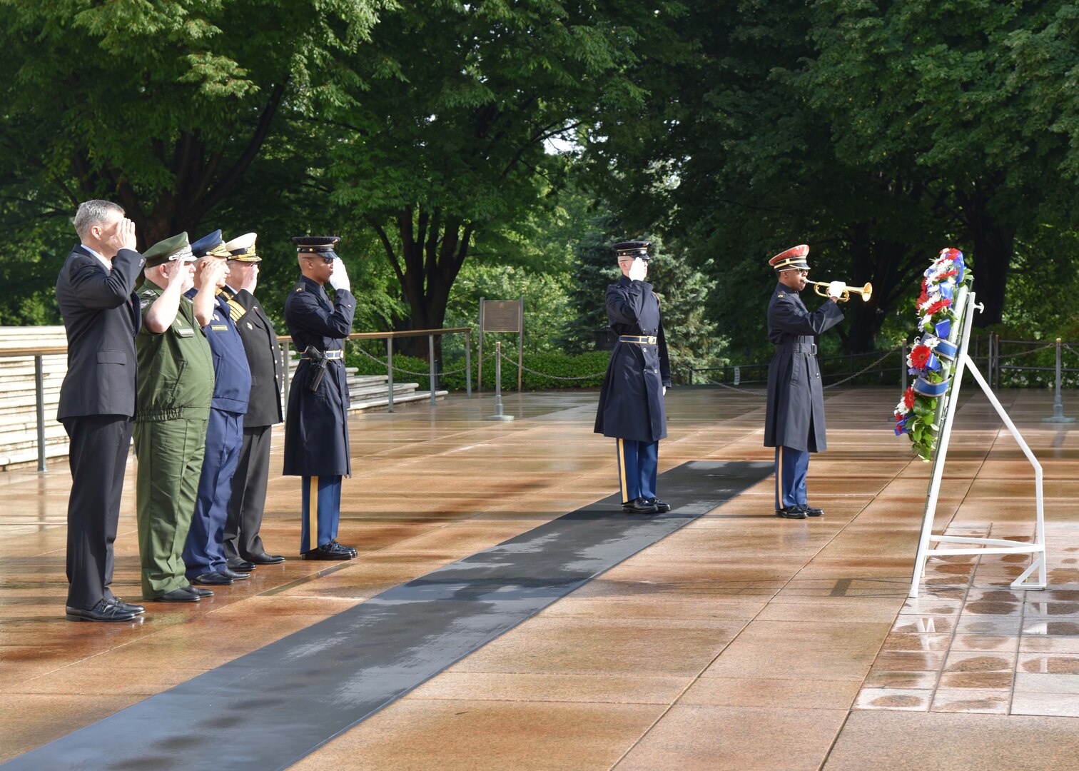 Mr. Michael Linnington, left, director of the Defense POW/MIA Accounting Agency, salutes alongside General-Major Aleksandr V. Kirilin, Assistant to the Russian Deputy Minister of Defense, General-Colonel Valeriy A. Vostrotin, Chairman of the Russian Union of the Public Associations of the Airborne Troops Veterans, and Admiral Vladimir P. Komoedov, Chief of the Russian State Duma Defense Committee, following a wreath-laying ceremony at Arlington National Cemetery, May 23. The men, along with other delegates of the U.S.-Russia Joint Commission on POW/MIAs met May 23 and May 24 in Arlington, Virginia, to discuss U.S.-Russia cooperation on the humanitarian mission of personnel accounting. 