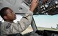 Staff Sgt. Terrell Cole, a 660th Aircraft Maintenance Squadron communication/navigation mission systems craftsman, runs tests on the control panel of a KC-10 Extender at Travis Air Force Base, Calif. Cole troubleshoots aircraft discrepancies and repairs and inspects communication and navigation systems. (U.S. Air Force photo/Senior Airman Amber Carter)