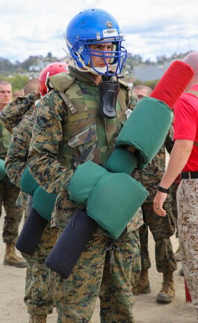 A recruit with Bravo Company, 1st Recruit Training Battalion, waits for his turn to fight during Pugil Sticks III at Marine Corps Recruit Depot San Diego, May 24. Each recruit’s gear was inspected by a drill instructor to ensure it was tight enough to endure any hits from a pugil stick. Annually, more than 17,000 males recruited from the Western Recruiting Region are trained at MCRD San Diego. Bravo Company is scheduled to graduate June 17.