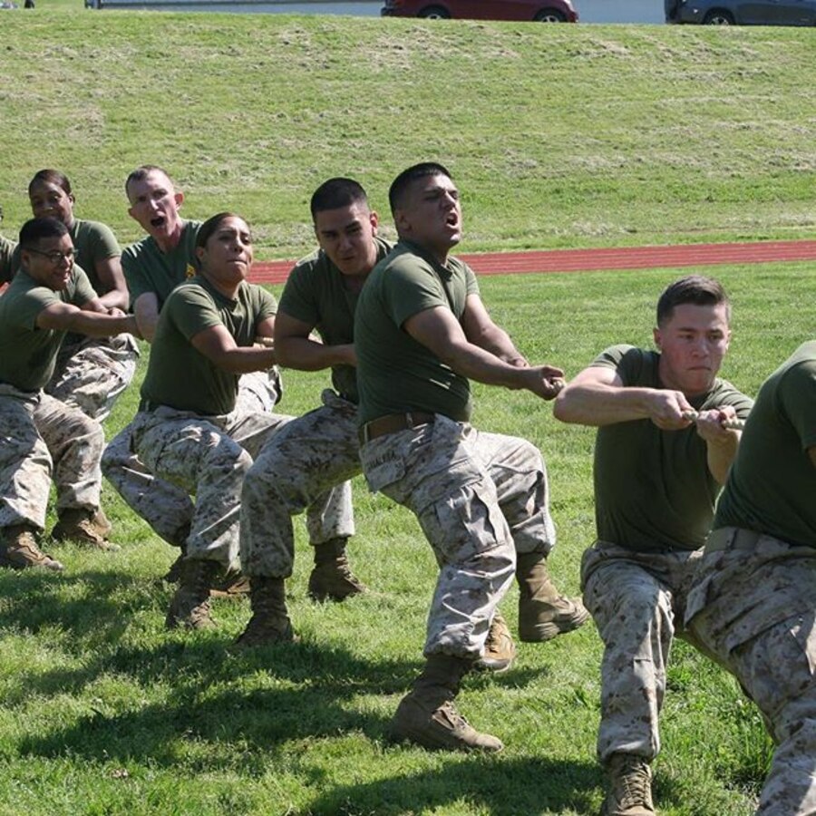 Marines in Service Company compete in tug-of-war at a safety stand-down and field meet sponsored by Headquarters and Service Battalion and CSACC May 25.
