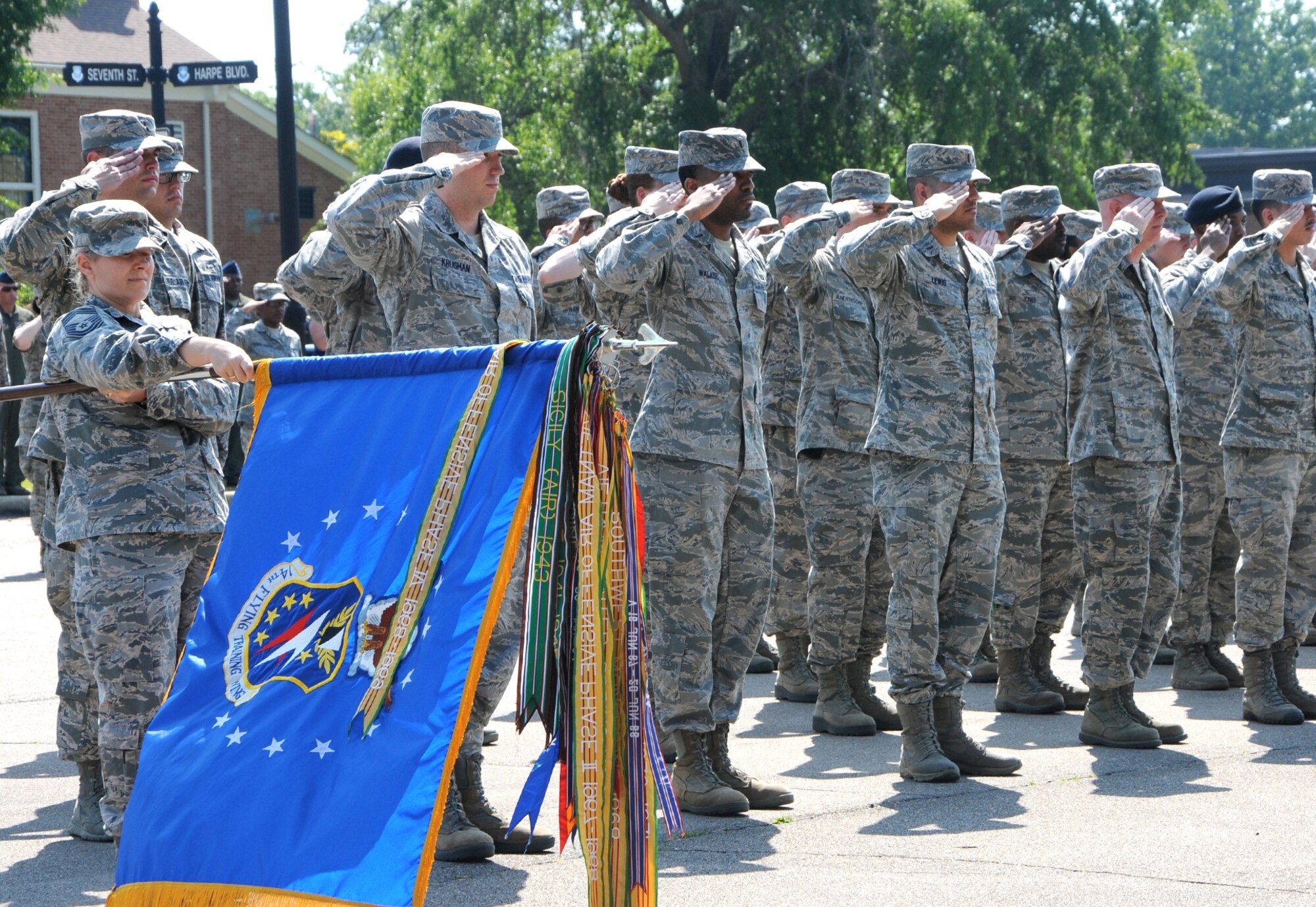 Team BLAZE Airmen stand in formation and salute during the Memorial Day Retreat Ceremony May 26 at Columbus Air Force Base, Mississippi. On the first Decoration Day, Gen. James Garfield made a speech at Arlington National Cemetery, and 5,000 participants decorated the graves of the 20,000 Union and Confederate soldiers buried there. (U.S. Air Force photo/Senior Airman Kaleb Snay)