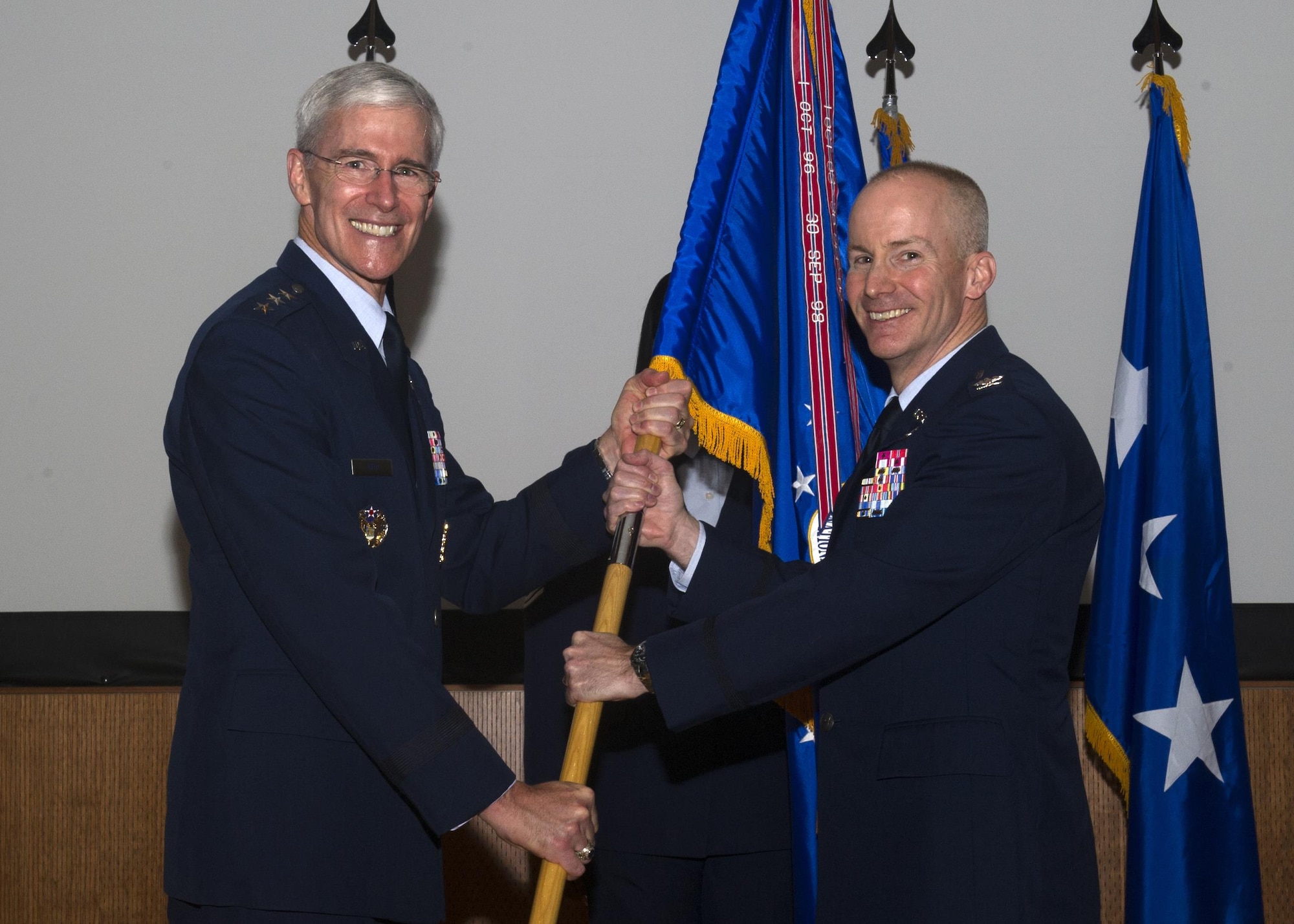 Lt. Gen. Robert P. Otto, Air Force’s Deputy Chief of Staff for Intelligence, Surveillance, and Reconnaissance, passes the National Air and Space Intelligence Center’s guidon to Col. Sean P. Larkin, NASIC commander, during the center’s change of command ceremony at Wright-Patterson Air Force Base, Ohio, May 26. Hundreds of NASIC personnel attended the ceremony and watched as Larkin became the Center’s newest commander. (U.S. Air Force photo/Senior Airman Matthew Lotz)