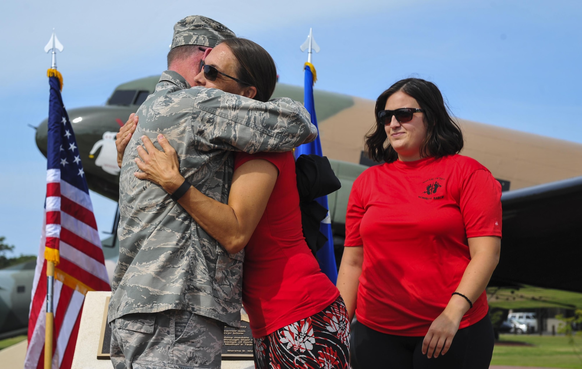 Maj. Gen. Eugene Haase, the vice commander of Air Force Special Operations Command, hugs Rachel Henry, the resource administrator with AFSOC, during the Gold Star Mothers plaque dedication ceremony at Hurlburt Field, Fla., May 25, 2016. The plaque was presented to Lt. Gen. Brad Heithold, commander of AFSOC, by George Turak, a Vietnam veteran, during a ceremony held Sept. 18, 2015, to honor the family members of AFSOC’s fallen service members. (U.S. Air Force photo by Airman 1st Class Joseph Pick)
