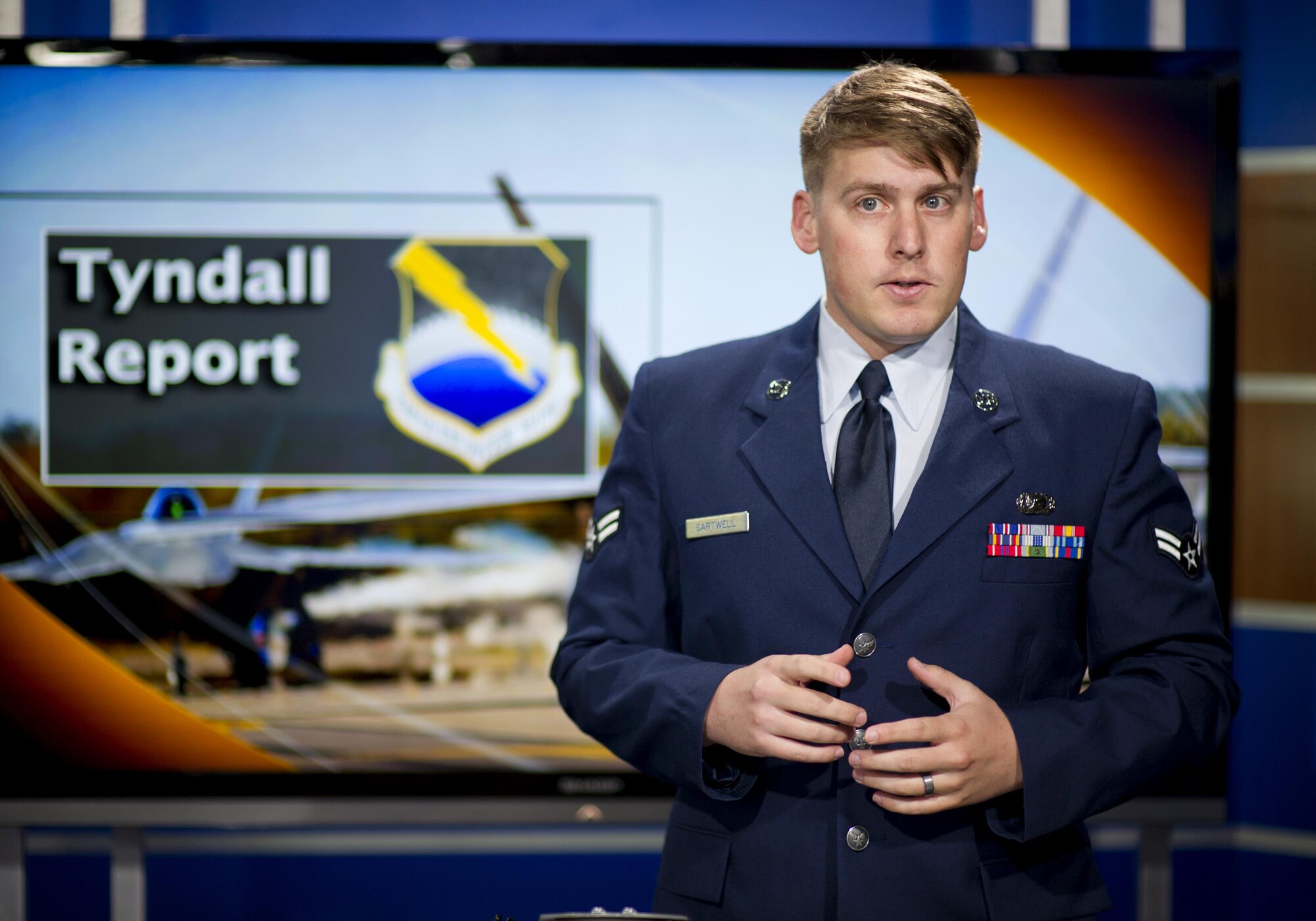 Airman 1st Class Roswell Sartwell, 325th Fighter Wing Public Affairs broadcaster, prepares for the Tyndall Report May 25, at WMBB, News 13, Panama City, Fla. The Tyndall Report is a one to two-minute news segment broadcast on several Bay County television news stations that delivers base news to the local community. (U.S. Air Force photo by Senior Airman Alex Fox Echols III)