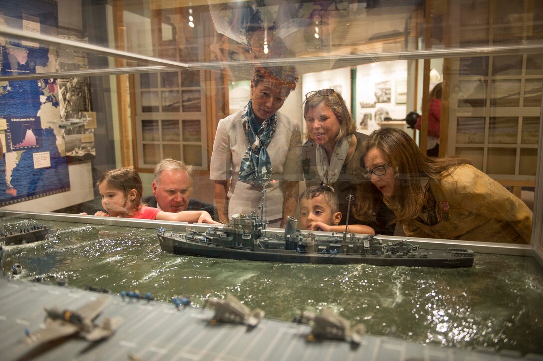 Military family members enjoy exhibits at Hampton Roads Naval Museum following a press conference to launch this year's Blue Star  Museums program, Norfolk, Va., May 26, 2016. Blue Star Museums is a collaboration among the National Endowment for the Arts, Blue Star Families, the Department of Defense and more than 2,000 museums across America to offer free admission to the nation's active duty military members and their families from Memorial Day through Labor Day. Navy photo by Petty Officer 3rd Class Amy M. Ressler