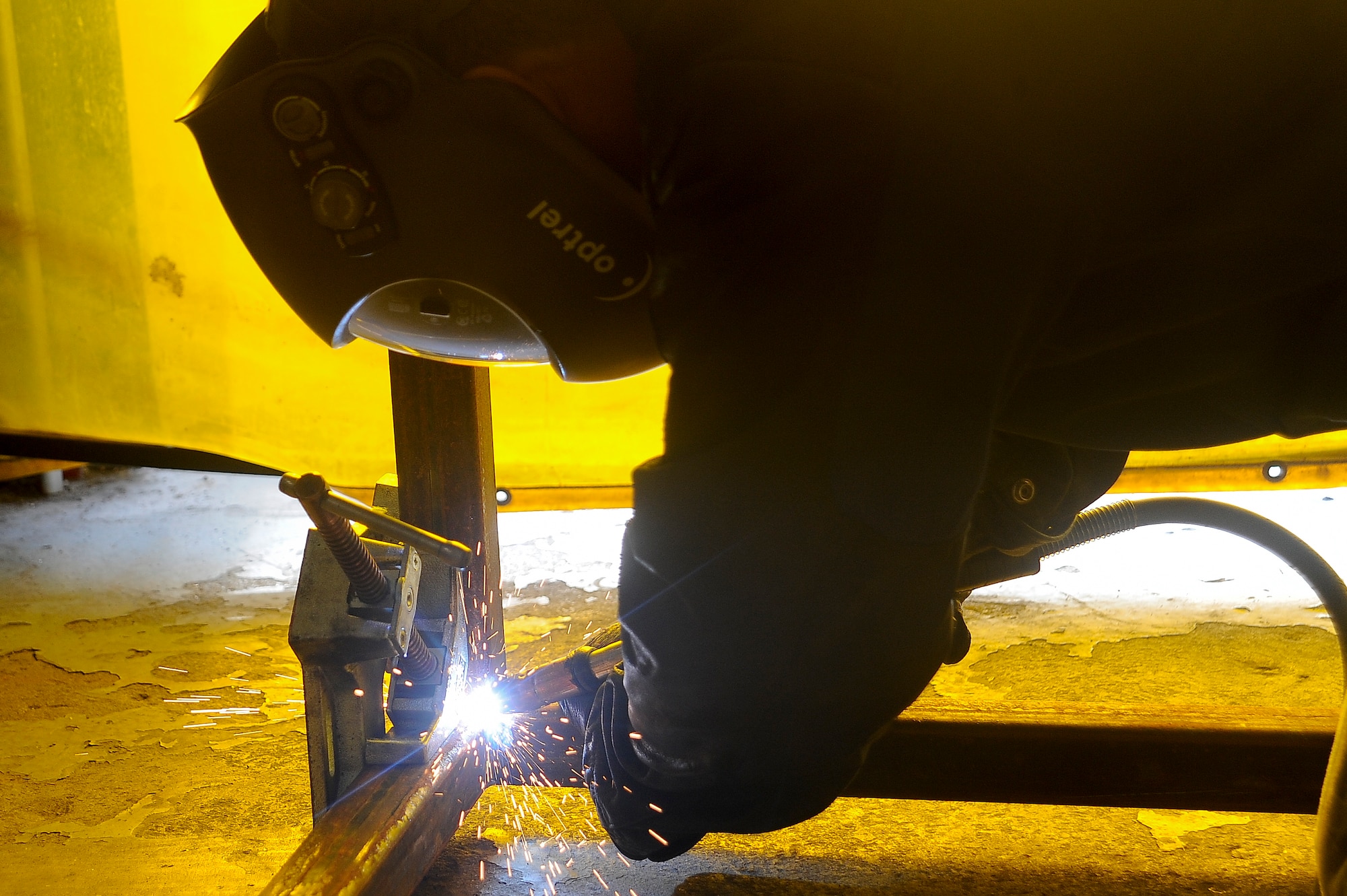 Staff Sgt. Armand Guting, an aircraft metals technology technician with the 6th Maintenance Squadron, welds a corner of the paint rack at MacDill Air Force Base, Fla., May 20, 2016.  The paint rack will allow for aircraft parts to be painted on all sides at once instead of painting one side at a time and waiting for it to dry. (U.S. Air Force photo by Airman 1st Class Mariette Adams)