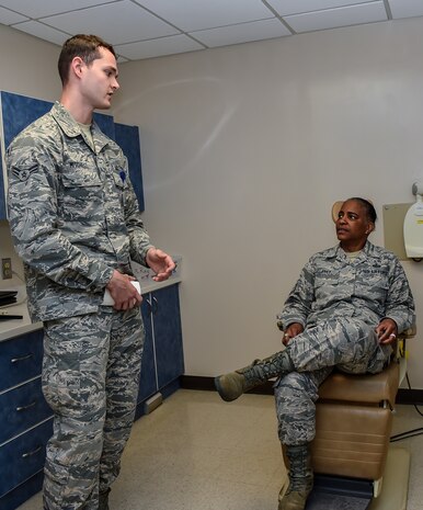 Airman 1st Class Shawn Mitchell, a 628th Medical Group dental assistant, gives Command Chief Master Sgt. Shelina Frey, Air Mobility Command chief, a tour of the X-Ray room in the dental clinic during her visit to Joint Base Charleston May 22 - 27, 2016. The 628th Medical Group’s highly trained staff is dedicated to providing superior health dental care, anytime, anywhere. (U.S Air Force Photo/Airman Megan Munoz)
