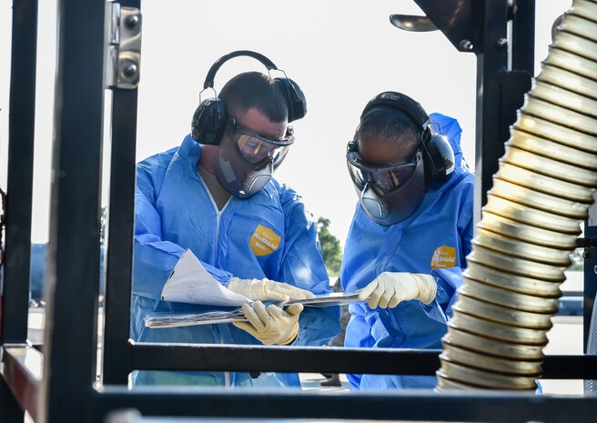 SrA Adgar Brown, a 437th Aerial Port Squadron fleet operations journeyman, teaches Command Chief Master Sgt. Shelina Frey, Air Mobility Command chief, how to clean the lavatory on a C-17 Globemaster III during her visit to Joint Base Charleston May 22 - 27, 2016. The mission of the 437th APS is to provide responsive global cargo and passenger movement operations while developing combat-ready Airmen. (U.S Air Force Photo/Airman Megan Munoz)
