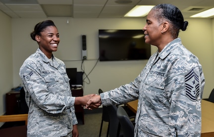 Command Chief Master Sgt. Shelina Frey, Air Mobility Command chief, meets with Airman 1st Class Jalyn Moats-Paige, a 628th Medical Group mental health technician, during her visit to Joint Base Charleston May 22 - 27, 2016. The mental health clinic offers counseling services to service members and adult dependents and runs the Air Force Alcohol and Drug Abuse Prevention Treatment program at JB Charleston. (U.S Air Force Photo/Airman Megan Munoz)
