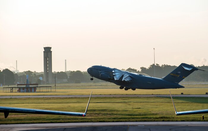 One of ten C-17 Globemaster IIIs takes off during a large formation exercise as part of Crescent Reach 16, May 26, 2016, at Joint Base Charleston, S.C. The exercise tested JB Charleston’s ability to launch a large aircraft formation and mobilize a large amount of cargo and passengers. (U.S. Air Force photo/Staff Sgt. Jared Trimarchi)