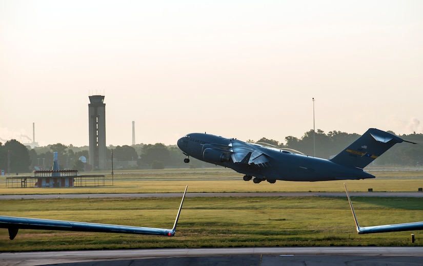 One of ten C-17 Globemaster IIIs takes off during a large formation exercise as part of Crescent Reach 16, May 26, 2016, at Joint Base Charleston, S.C. The exercise tested JB Charleston’s ability to launch a large aircraft formation and mobilize a large amount of cargo and passengers. (U.S. Air Force photo/Staff Sgt. Jared Trimarchi)