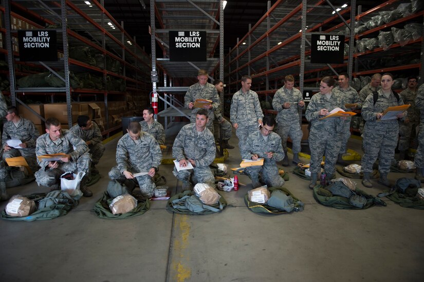 Airmen inspect their deployment gear as part of Exercise Crescent Reach 16, May 24, 2016, at Joint Base Charleston, S.C. The exercise tested JB Charleston’s ability to launch a large aircraft formation and mobilize a large amount of cargo and passengers. (U.S. Air Force photo/Staff Sgt. Jared Trimarchi)
