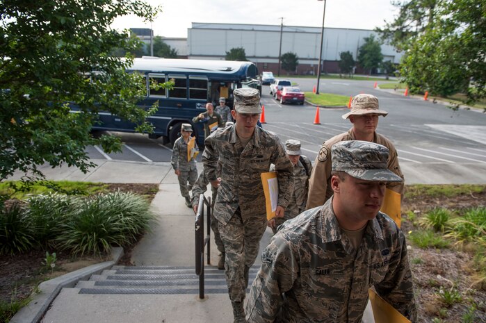 Airmen proceed to a deployment line during  Exercise Crescent Reach 16, May 24, 2016, at Joint Base Charleston, S.C. The exercise tested JB Charleston’s ability to launch a large aircraft formation and mobilize a large amount of cargo and passengers. (U.S. Air Force photo/Staff Sgt. Jared Trimarchi)
