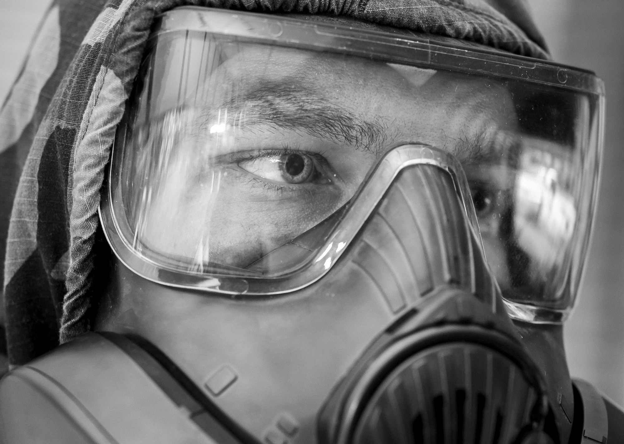 An Airman wears a gas mask during a chemical, biological, radiological, nuclear and explosives drill as part of Exercise Crescent Reach 16, May 19, 2016, at Joint Base Charleston, S.C. The exercise tested JB Charleston’s ability to launch a large aircraft formation and mobilize a large amount of cargo and passengers. (U.S. Air Force photo/Staff Sgt. Jared Trimarchi)