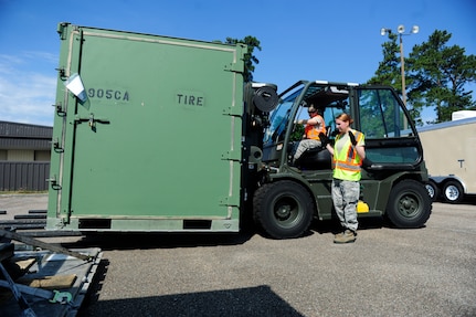 Senior Airman Brandilyn Grant, from the 437th Aerial Port Squadron (right), guides Airman 1st Class Sarah White in forklift operations during a mobility exercise May 24, 2016, at Joint Base Charleston, S.C. The mobility portion is part of a larger exercise, Crescent Reach 2016, which tests the 437th Airlift Wing’s and the 628th Air Base Wing’s ability to deploy passengers and cargo as well as launch a large aircraft formation in response to a worldwide crisis. (U.S. Air Force Photo by Airman 1st Class Kevin J. West)