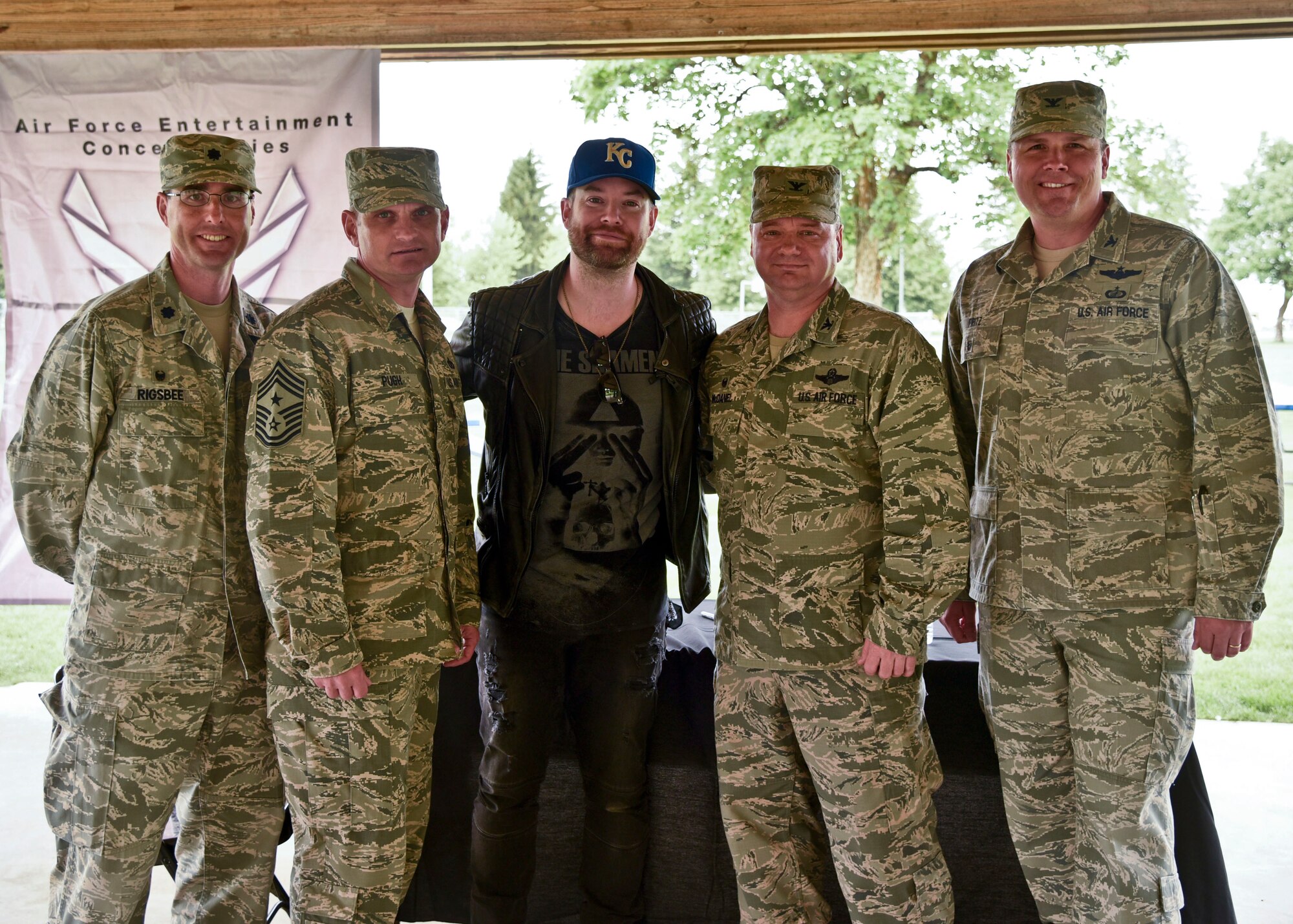 David Cook, American Idol winner, poses with base leadership after performing a free concert May 26, 2016 at Fairchild Air Force Base, Wash. “Capping off the day before a Memorial Day weekend, with a concert by an American Idol star like David Cook, is what I would call a phenomenal day for Team Fairchild!” said Col. Matthew Fritz, 92nd Air Refueling Wing vice commander.  “I'm thrilled to welcome David Cook to our base and show him Team Fairchild!”