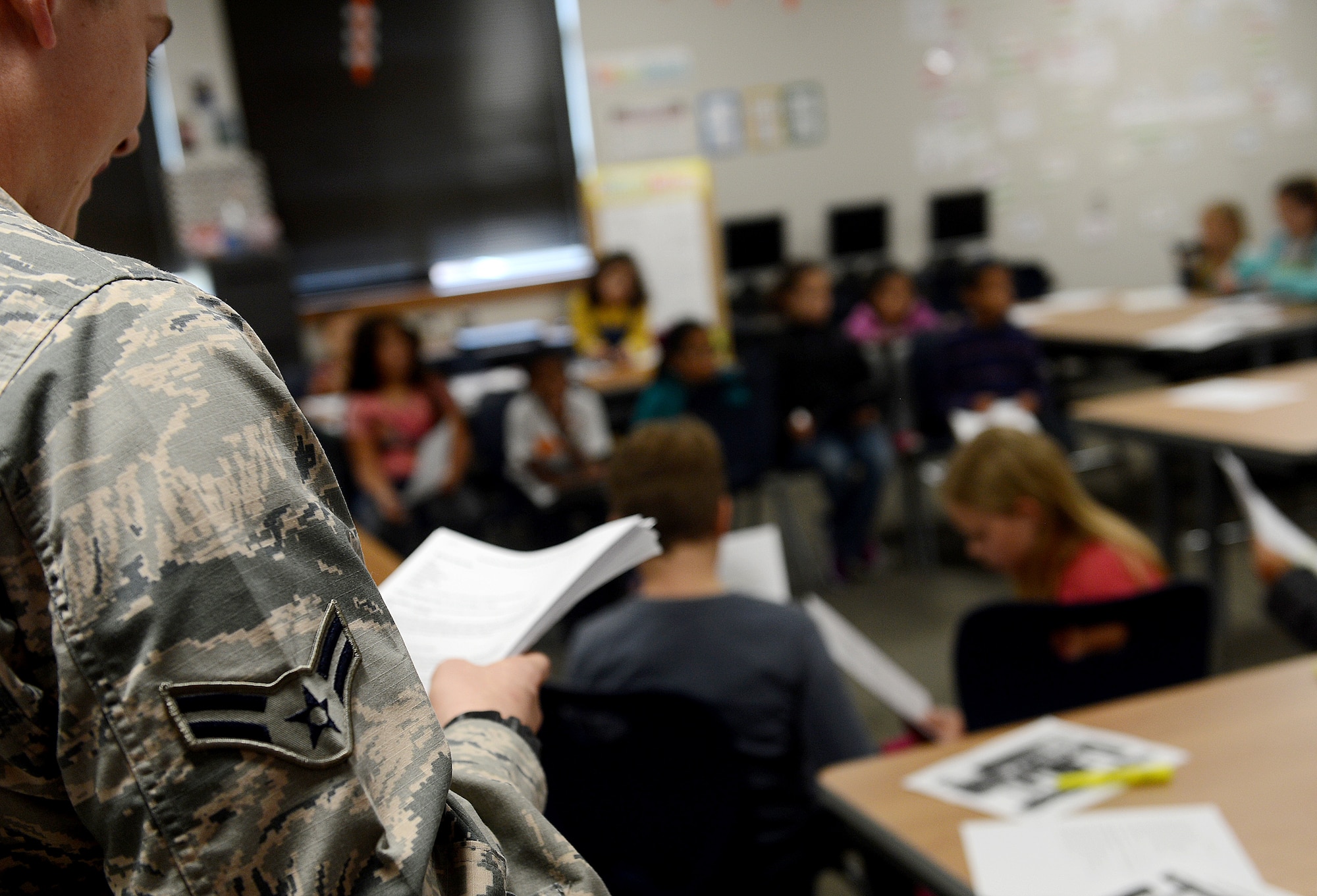 Airman 1st Class Chad Berney, 62nd Airlift Wing paralegal, holds a mock trial for students from Carter Lake Elementary School, Joint Base Lewis-McChord, Wash., during the nation-wide Law Day May 25, 2016. More than 60 students from Carter Lake Elementary School participated in the Law Day activities put on by members from the 62nd AW legal office. (U.S. Air Force photo/Senior Airman Divine Cox)