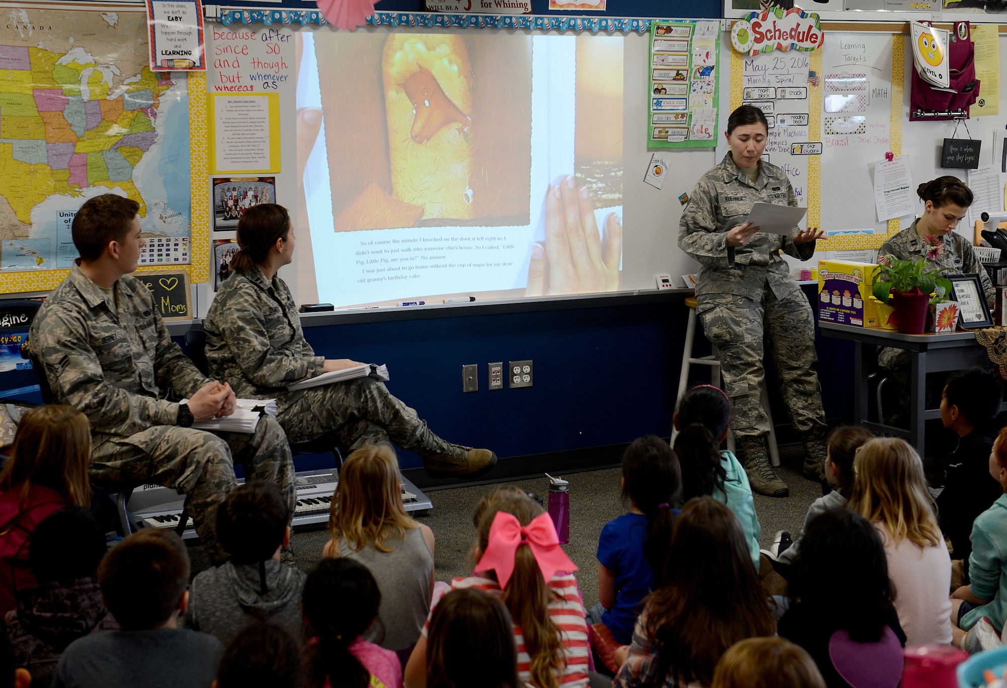 Members of the 62nd Airlift Wing Legal office visit with students of Carter Lake Elementary School, Joint Base Lewis-McChord, Wash., for the nation-wide Law Day May 25, 2016. The legal office read “The Three Little Pigs” to the students and conducted a mock trial afterwards for the “Wolf” from the story. (U.S. Air Force photo/Senior Airman Divine Cox)