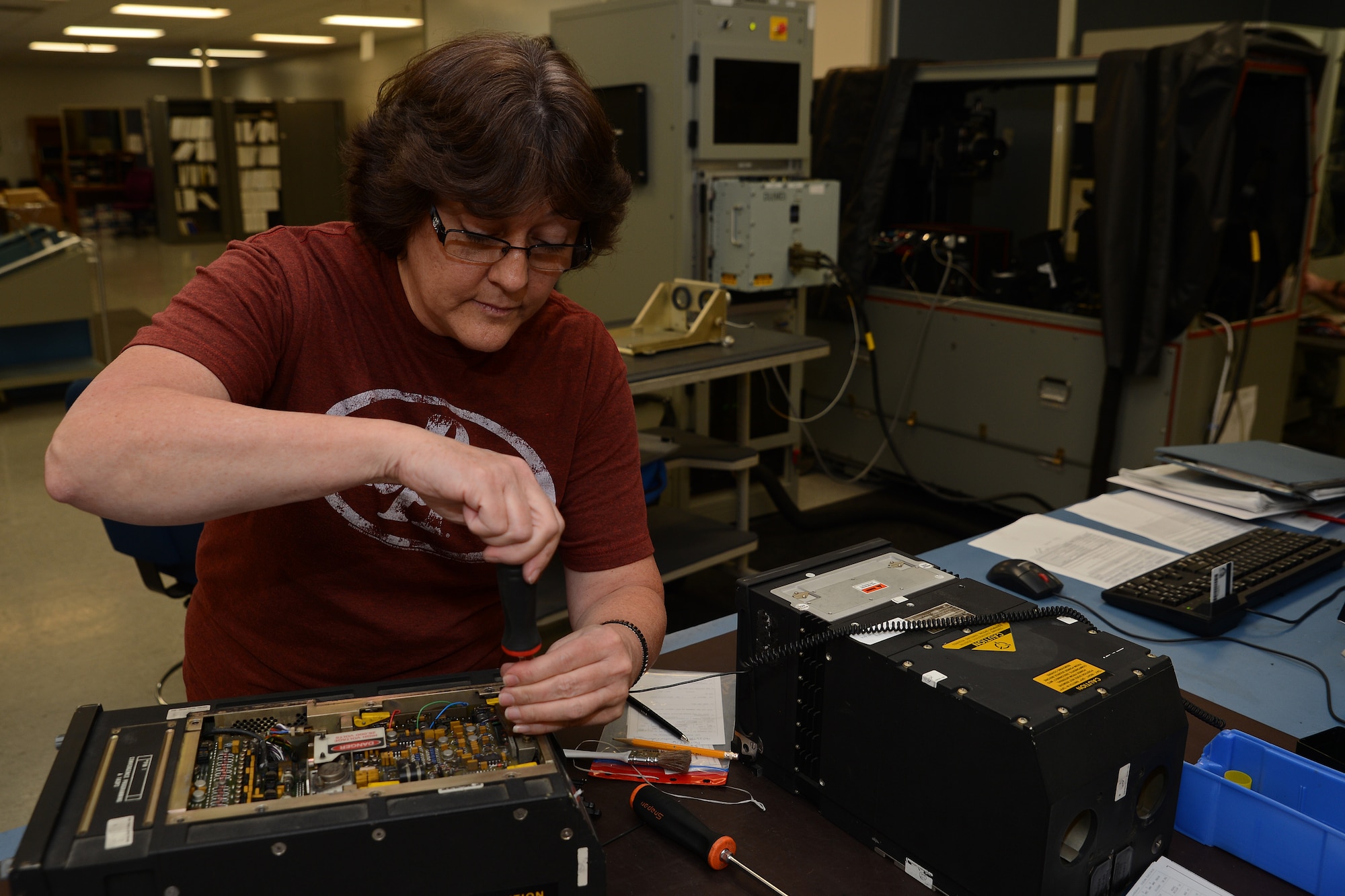 Carla De Ruysscher, 62nd Maintenance Squadron avionics technician, takes apart a C-17 multi-function display unit May 24, 2016, at Joint Base Lewis-McChord, Wash. Valued at $192,000, each C-17 multi-function display unit refurbished by the flight results in savings for the Air Force and provides a surplus of replacement assets for the Air Force’s C-17 fleet. (U.S. Air Force photo/ Senior Airman Jacob Jimenez) 