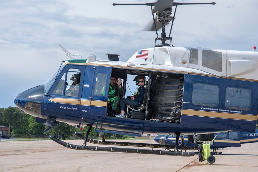 Maj. Gen. Laurian Anastasof, Romanian Air Force chief of air staff (center), waves during takeoff in a 1st Helicopter Squadron UH-1N Huey helicopter at Joint Base Andrews, Md., May 23, 2016. Anastasof and his wife, Karmen Anastasof, flew with the 1st HS as part of the U.S. Air Force’s Counterpart Visit Program.    (U.S. Air Force photo by Airman Gabrielle Spalding)