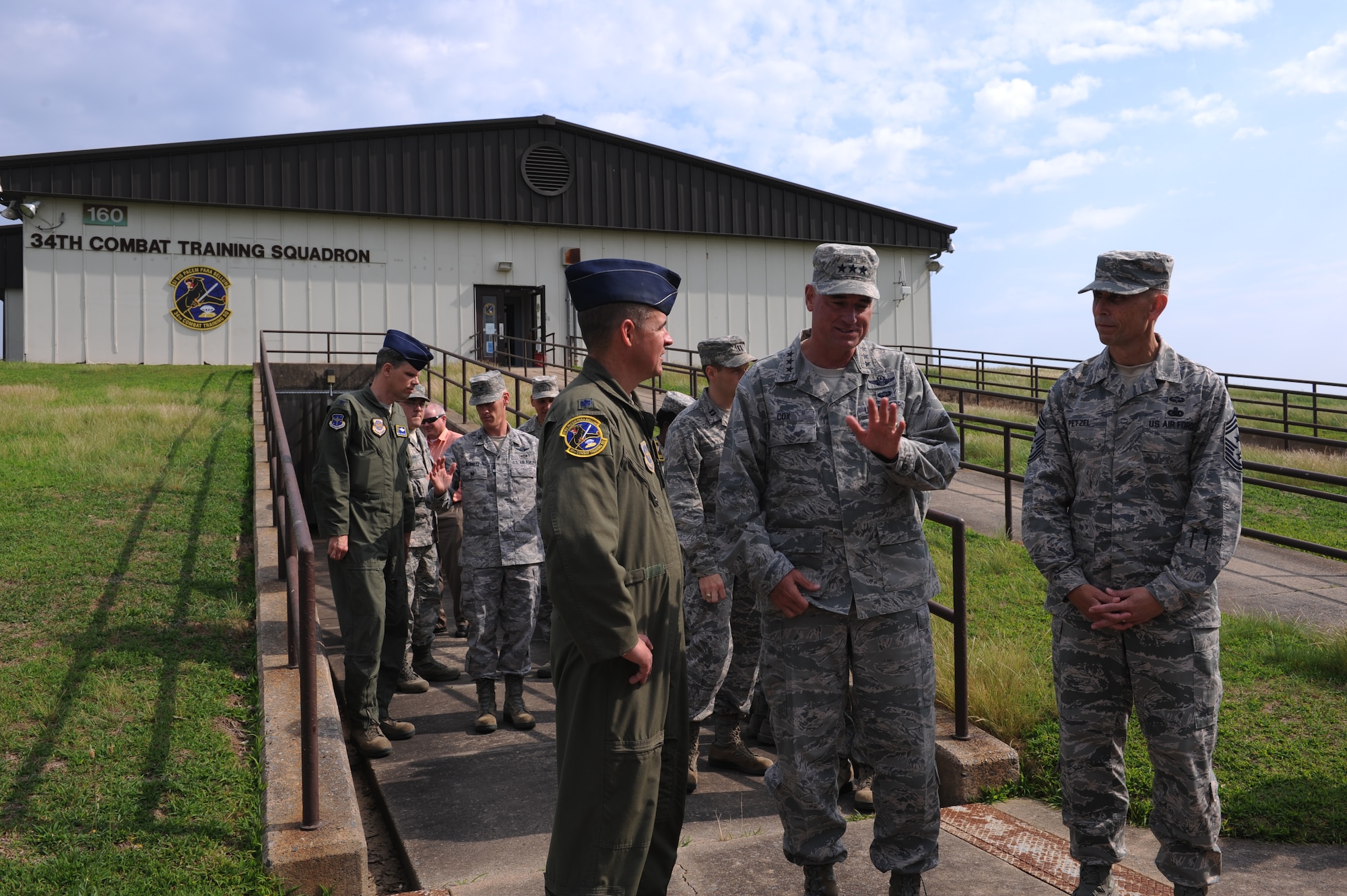 U.S. Air Force Lt. Gen. Sam Cox, center, 18th Air Force commander, discusses training and preparedness with U.S. Air Force Lt. Col. Steve Smith, left, 34th Combat Training Squadron commander, May 24, 2016, at Bldg. 160 on Little Rock Air Force Base, Ark. The 34th CTS conducts realistic, tactical-level, joint combat training tailored to the needs of Mobility Air Forces and coordinates Green Flag, one of Air Mobility Command's largest rotational exercises. (U.S. Air Force photo by Senior Airman Mercedes Taylor) 