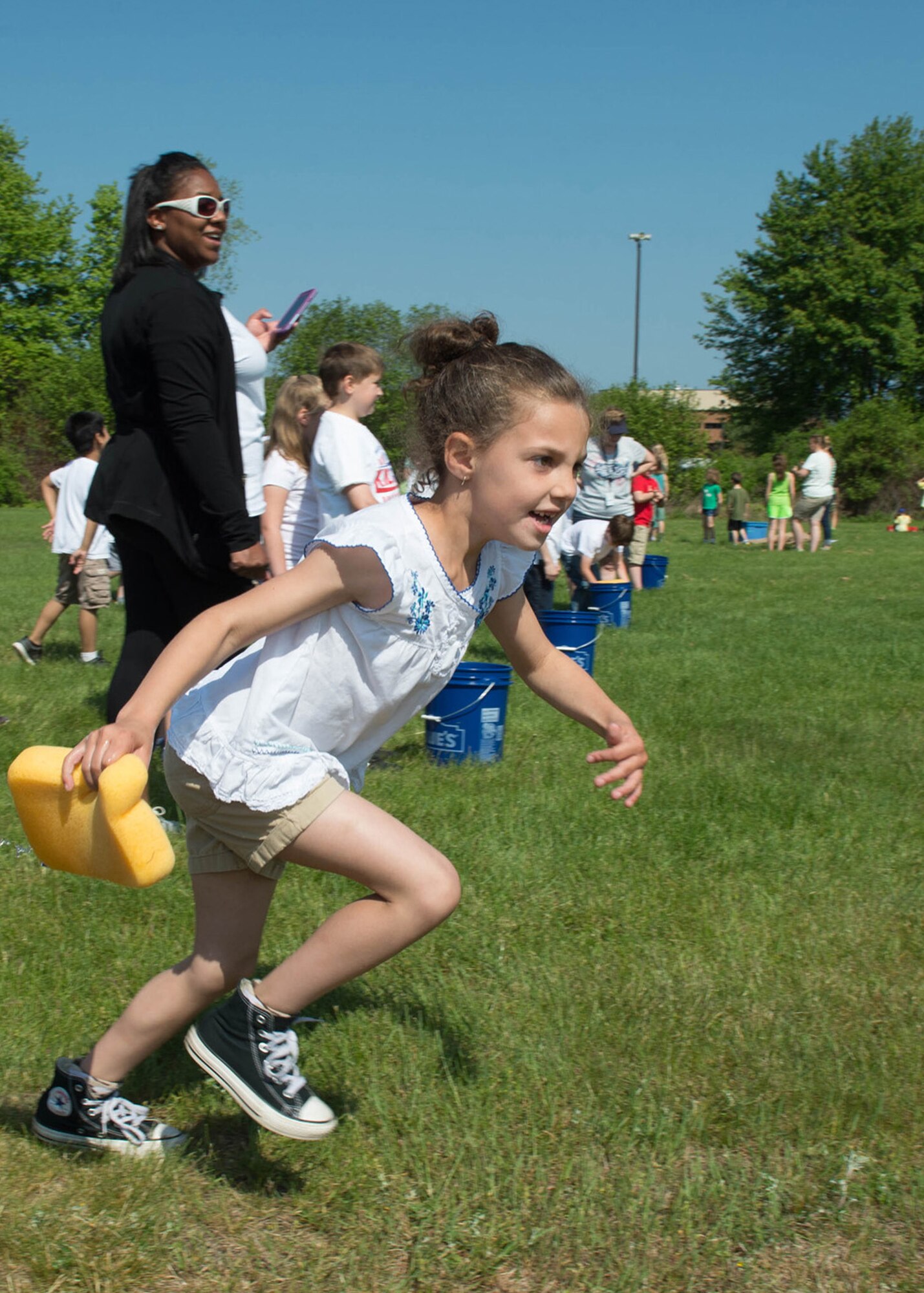Hanscom Primary School first grader Marley Underwood takes off during the school's annual field day event on base May 25. Primary school students participated in games and activities as part of the event. (U.S. Air Force photo by Jerry Saslav)