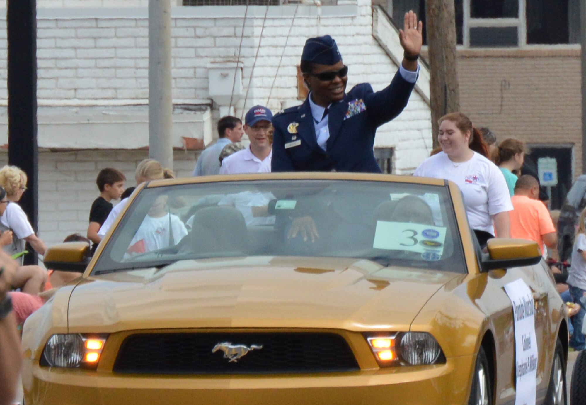 Col. Stephanie Wilson, 72nd Air Base Wing commander, waves to the crowd at the 2016 Armed Forces Day parade May 21 in Del City. Colonel Wilson served as the parade's grand marshal. (Air Force photo by April McDonald/Released)