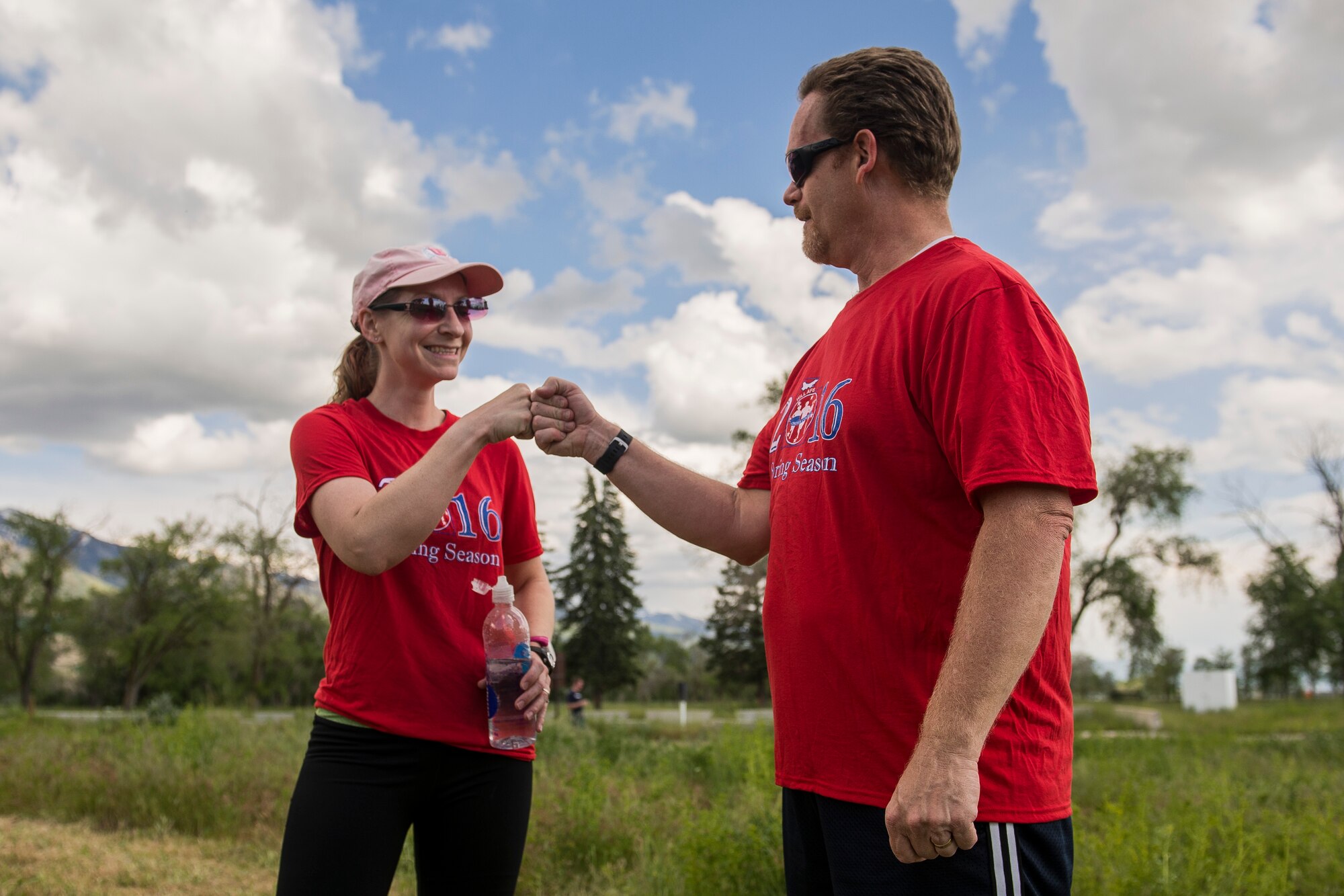Mandee Soltys fist bumps Gary Owens following the ‘Frisbee’ race, May 25. The race, part of the Hill Air Force Base Spring Race series, was the season’s last. (U.S. Air Force photo by Paul Holcomb)