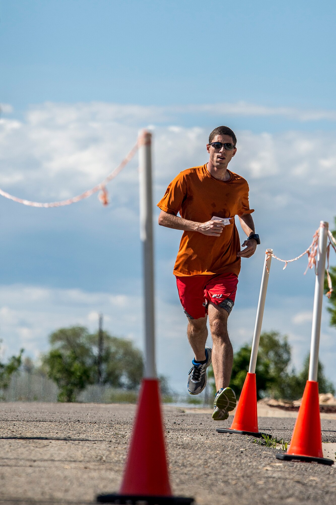 Matt Sandstrom crosses the finish line, completing the Hill Air Force Base Spring Race Series’ seventh race, May 18, 2016. Sandstrom’s winning time was 17:24. (U.S. Air Force photo by Paul Holcomb)