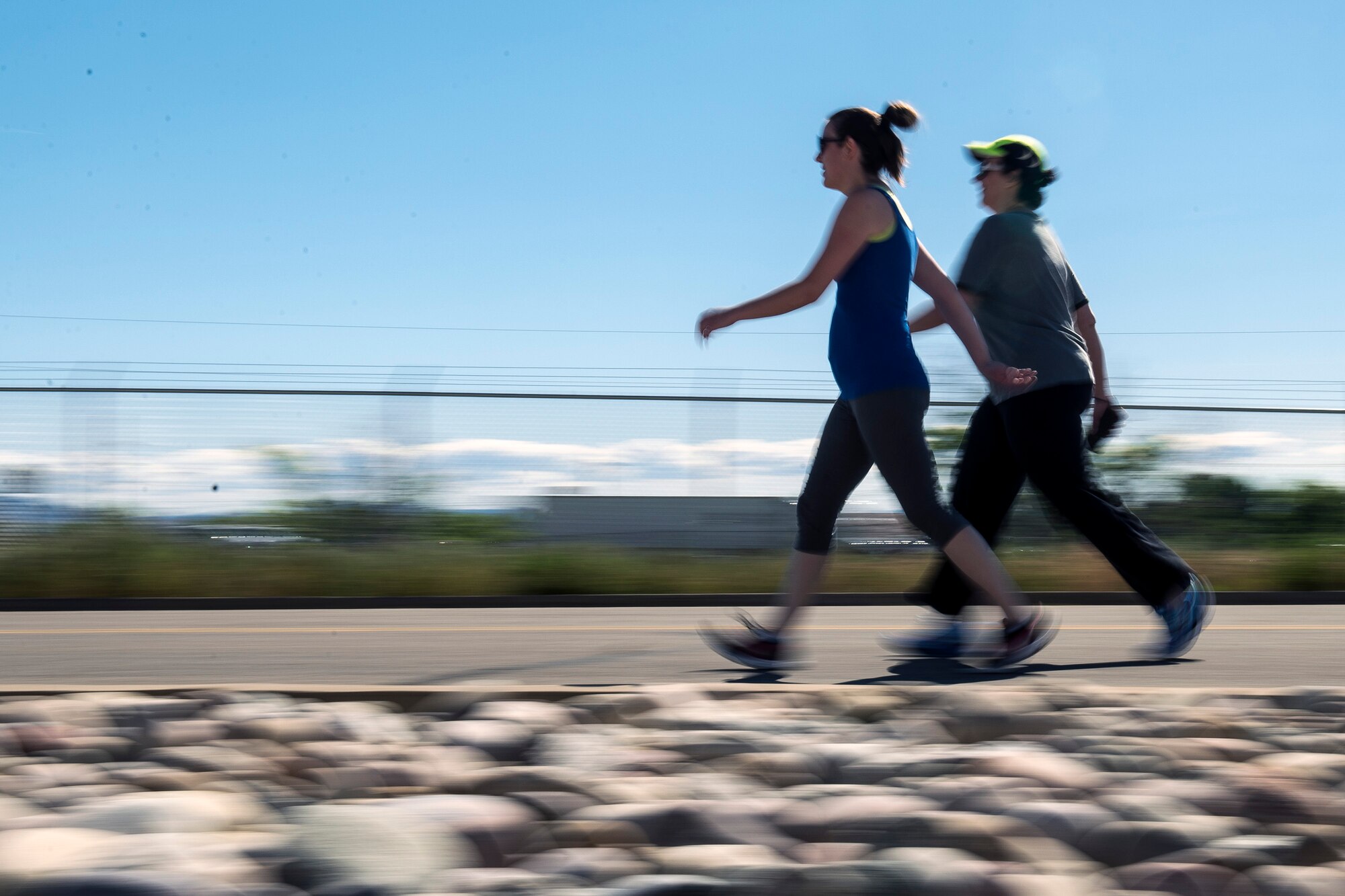 Michelle Goff, left, and Andrea Beringer approach the finish line of the Hill Air Force Base Spring Race Series’ seventh race, May 18, 2016. Runners, joggers, and walkers can compete in the free race series. The series has two race seasons, spring and fall. (U.S. Air Force photo by Paul Holcomb)
