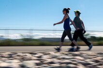 Michelle Goff, left, and Andrea Beringer approach the finish line of the Hill Air Force Base Spring Race Series’ seventh race, May 18, 2016. Runners, joggers, and walkers can compete in the free race series. The series has two race seasons, spring and fall. (U.S. Air Force photo by Paul Holcomb)