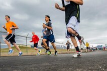 Runners compete April 13 during the Hill Air Force Base Spring Race Series. The season’s second race, depicted here, was run on the ‘MUNS’ course. The series’ goal is to promote camaraderie and participation. (U.S. Air Force photo by Paul Holcomb)
