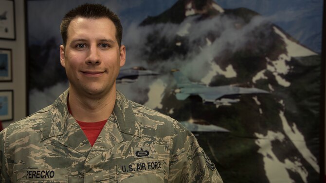 U.S. Air Force Tech. Sgt. Robert Perecko, a combat intelligence supervisor with the 13th Fighter Squadron, poses for a portrait at Misawa Air Base, Japan, May 25, 2016. Perecko was recognized as the Wild Weasel of the Week by the 13th FS for his outstanding work ethic, superior performance and overall good conduct and discipline. Perecko hails from Gloucester, Virginia. (U.S. Air Force photo by Airman 1st Class Jordyn Fetter)