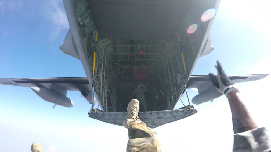 Tech. Sgt. Benjamin Johnis, 374th Operations Squadron NCO in charge of Survival, Evasion, Resistance and Escape operations, jumps from a C-130 Hercules at Yokota Air Base, Japan, May 23, 2016. Members with the 374 OSS SERE conduct regular jump training to stay qualified and achieve proficiency in their skills. (Courtesy photo by Tech. Sgt. Benjamin Johnis/Released)