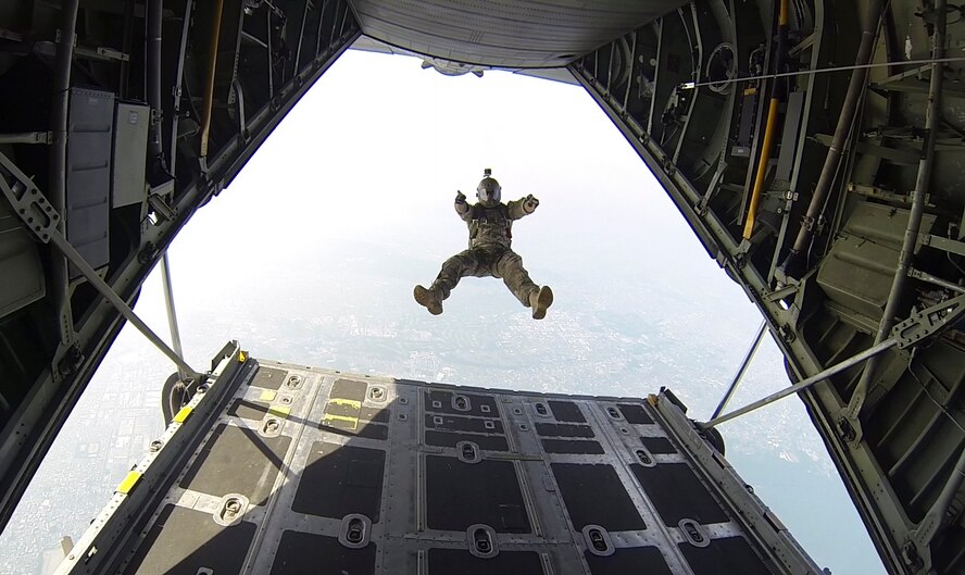 Tech. Sgt. Benjamin Johnis, 374th Operations Squadron NCO in charge of Survival, Evasion, Resistance and Escape operations, jumps from a C-130 Hercules at Yokota Air Base, Japan, May 23, 2016. Members with the 374 OSS SERE conduct regular jump training to stay qualified and achieve proficiency in their skills. (Courtesy photo by Staff. Sgt. Nickolas Alarcon/Released)