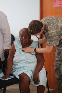 U.S. Army Capt. Angela Hunter, Joint Task Force-Bravo Medical Element physician assistant, examines an elderly woman’s vital signs during a Medical Readiness Training Exercise in Alamikamba, Nicaragua, May 18, 2016. Hunter was part of a JTF-Bravo team that participated in a two-day exercise in Nicaragua which provided the local population with preventive care, basic health care services, dental care and medications free of charge. A total of 1,265 Nicaraguans received care during the MEDRETE, which included participation from Nicaraguan Ministry of Health and Army in cooperation with JTF-Bravo service members and Honduran medical liaisons from Soto Cano Air Base, Honduras.  (U.S. Army photo by Maria Pinel)