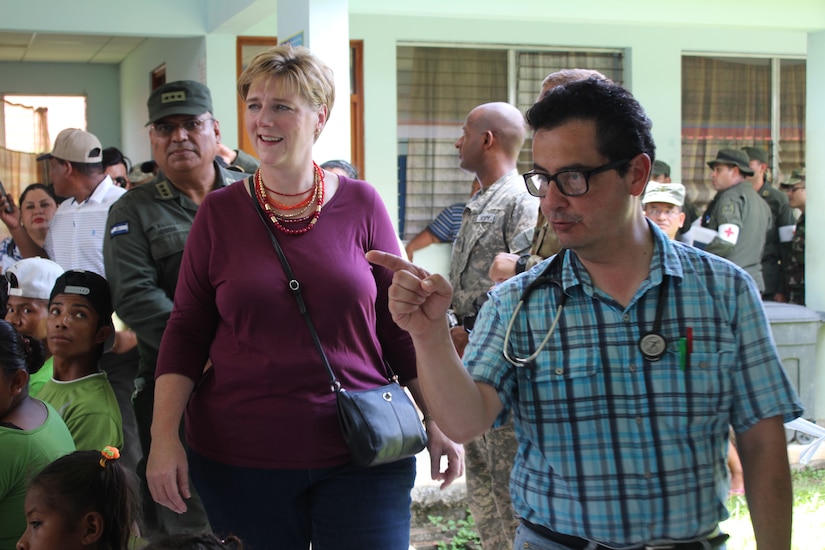 Dr. Carlos Duron, Joint Task Force-Bravo Medical Liaison, provides a tour of the distribution of medical services for Laura F. Doğu, Ambassador of the United States to Nicaragua, during a Medical Readiness Training Exercise. Ambassador Doğu visited the village along with US AID and Embassy representatives to witness first-hand the impact MEDRETEs have on a community. (U.S. Army photo by Maria Pinel)  