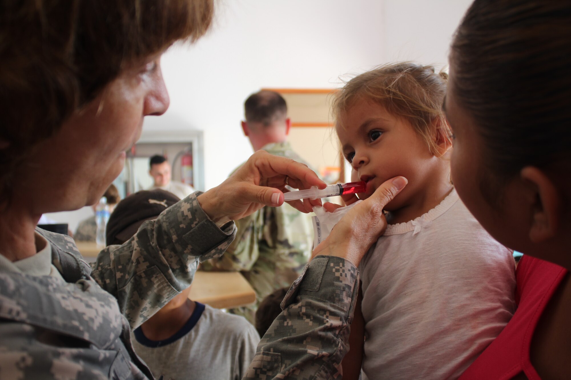 U.S. Army Capt. Katherine Matteson, Joint Task force-bravo public health nurse, applies deworming medication to a three-year-old girl as part of preventive medical care during a Medical Readiness Training Exercise, May 19, 2016, in Alamikamba, Nicaragua. The two-day exercise provided free health care for more than 1,200 patients from Alamikamba and other nearby communities. A total of 1,265 Nicaraguans received care during the MEDRETE, which included participation from Nicaraguan Ministry of Health and Army in cooperation with JTF-Bravo service members and Honduran medical liaisons from Soto Cano Air Base, Honduras.   (U.S. Army photo by Maria Pinel)