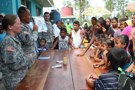 U.S. Army Staff Sgt. Lisa Kent and U.S. Army Sgt. Jason Nisperos, Joint Task Force-Bravo Preventive Medicine, provide a preventive medicine class for the people who visited the Prinzu Pawanka Hospital during a Medical Readiness Training Exercise in Alamikamba, Nicaragua, May 18, 2016. After receiving the initial health class, which provided guidance on how to avoid common illnesses, those present also received deworming medication, vitamins and soap. (U.S. Army photo by Maria Pinel)